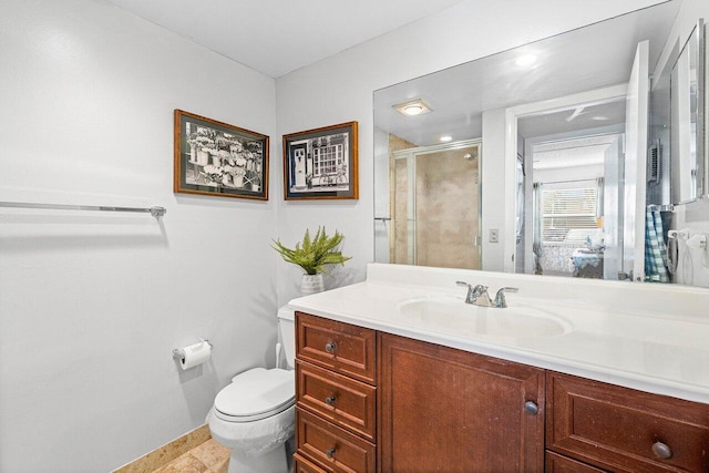 bathroom featuring tile patterned floors, vanity, toilet, and walk in shower