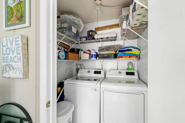 clothes washing area with independent washer and dryer