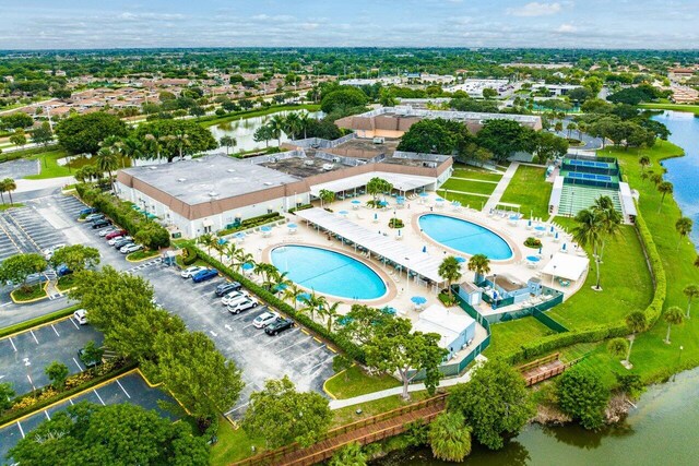 birds eye view of property featuring a water view