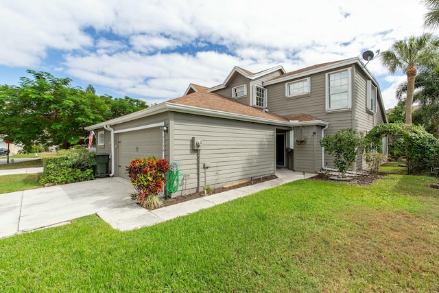 view of front of home with a front lawn and a garage