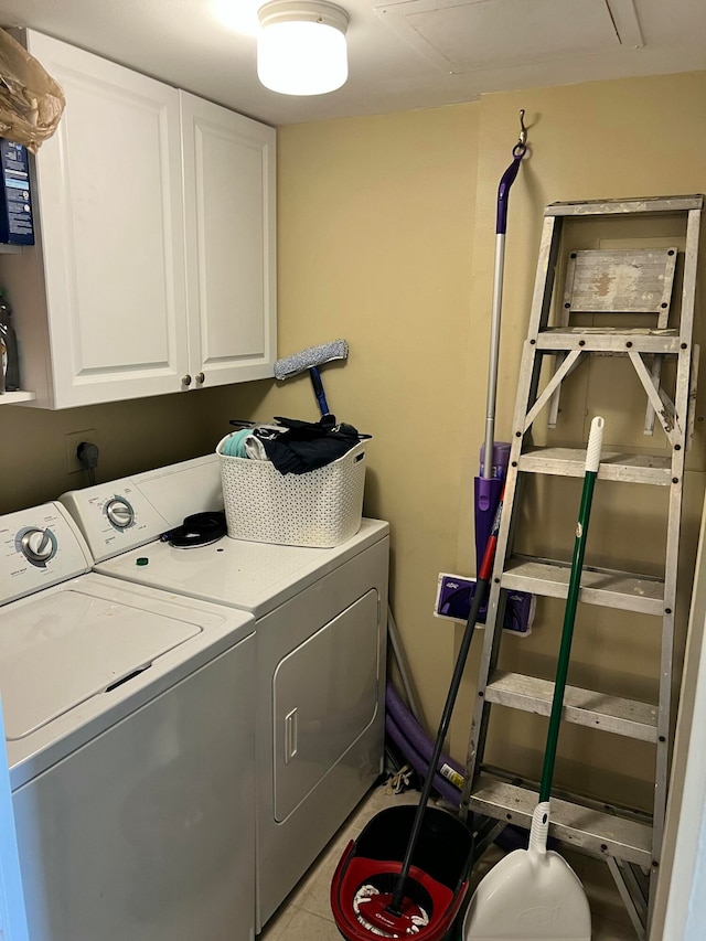 washroom with cabinets and independent washer and dryer