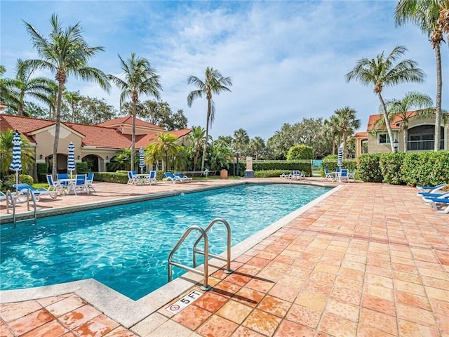 community pool featuring a patio area