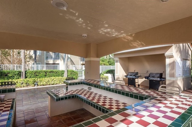 view of patio with fence and grilling area