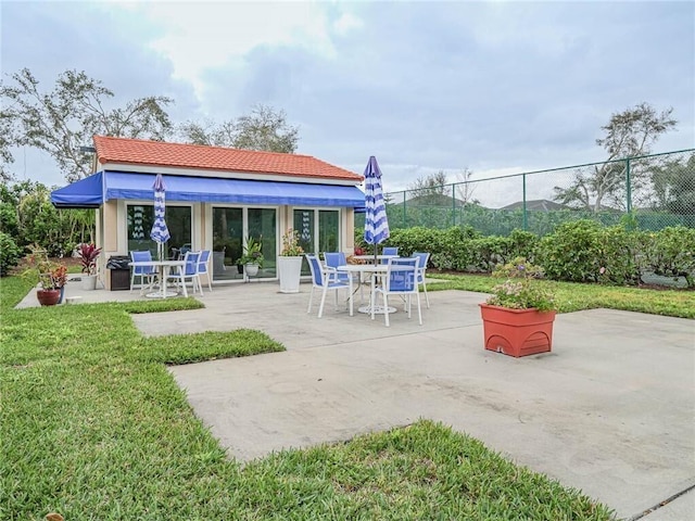 view of patio / terrace featuring outdoor dining area and fence