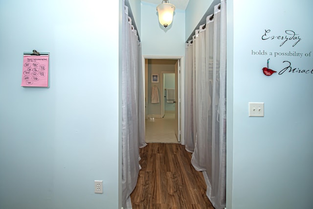 hall featuring dark wood-type flooring