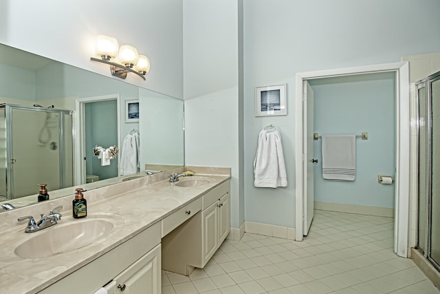 bathroom featuring tile patterned floors, vanity, toilet, and walk in shower