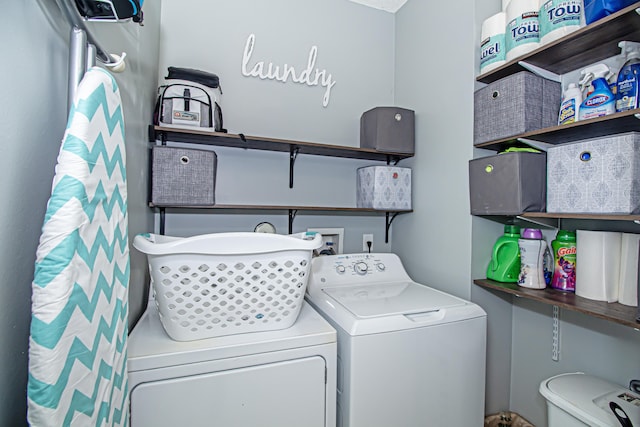 washroom featuring independent washer and dryer