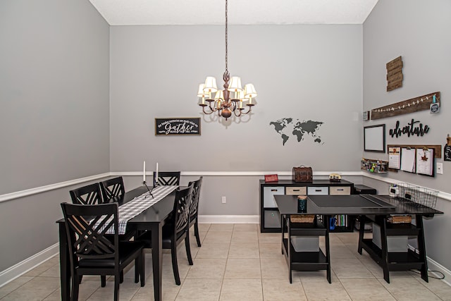 tiled dining area featuring an inviting chandelier