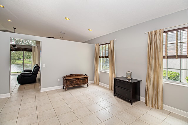 sitting room with plenty of natural light and light tile patterned flooring