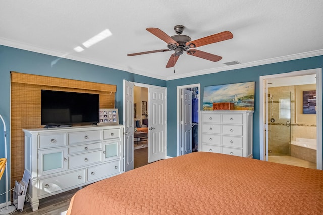 bedroom with wood-type flooring, connected bathroom, ceiling fan, and ornamental molding