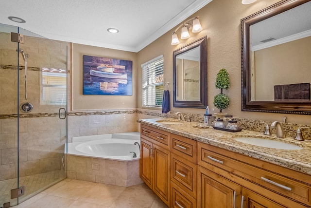 bathroom with plus walk in shower, tile patterned flooring, a textured ceiling, vanity, and ornamental molding