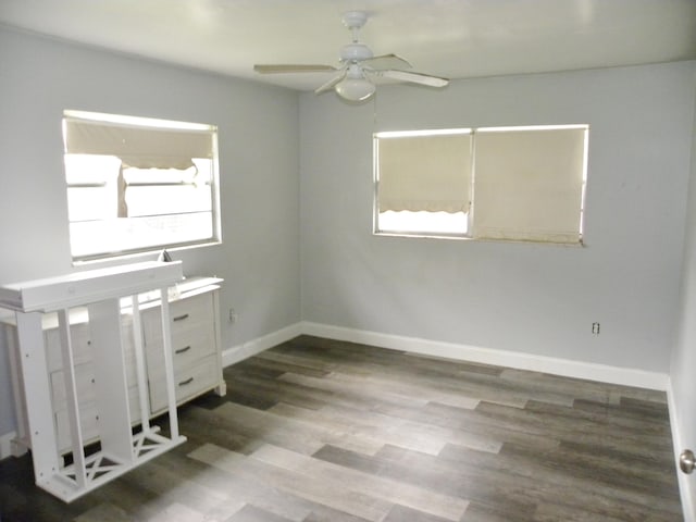 unfurnished room with hardwood / wood-style flooring and ceiling fan