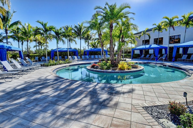 view of swimming pool featuring a gazebo and a patio