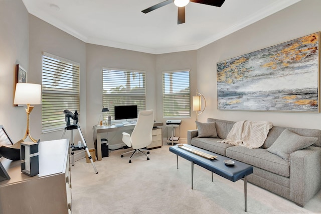 office area featuring light carpet, ceiling fan, and crown molding