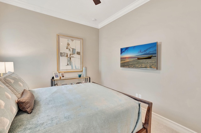 bedroom with carpet floors, ceiling fan, and crown molding