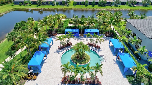 birds eye view of property with a water view