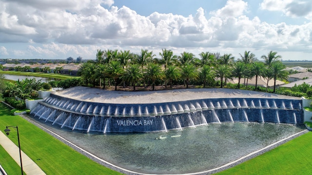 view of swimming pool featuring a water view