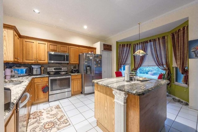 kitchen featuring tasteful backsplash, ornamental molding, stone countertops, and appliances with stainless steel finishes