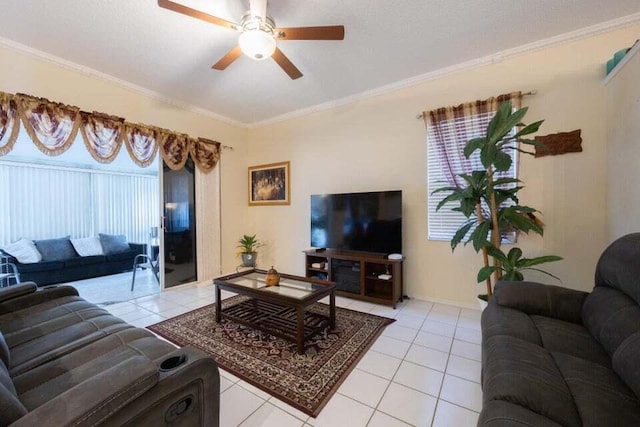 tiled living room with ceiling fan and crown molding