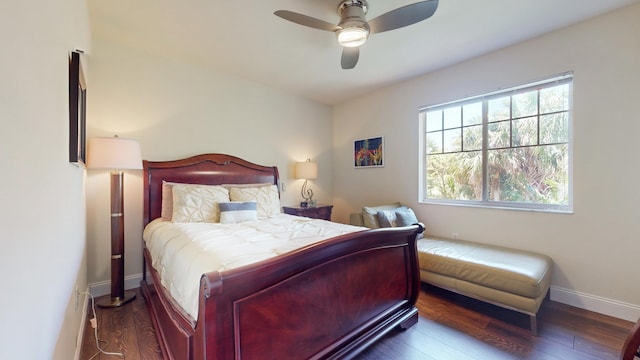 bedroom with ceiling fan and dark wood-type flooring