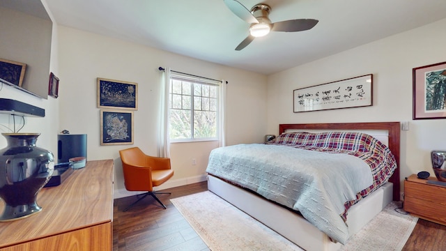 bedroom featuring ceiling fan and dark wood-type flooring