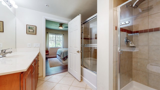 bathroom featuring tile patterned flooring, ceiling fan, and vanity