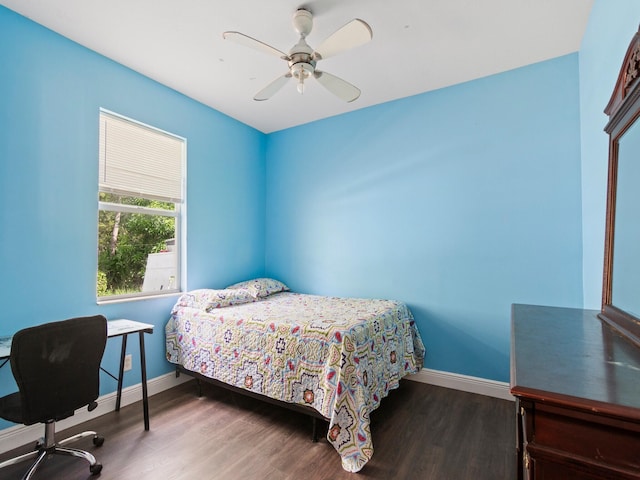 bedroom with ceiling fan and hardwood / wood-style flooring