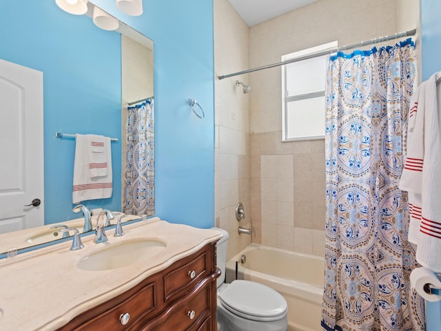 full bathroom featuring shower / bath combo with shower curtain, vanity, and toilet