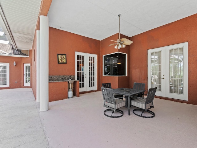 view of patio / terrace featuring ceiling fan and french doors