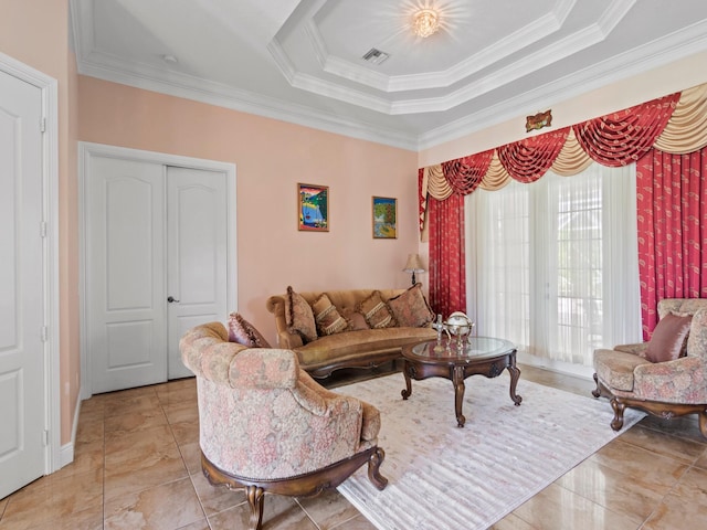 living room with a tray ceiling and ornamental molding