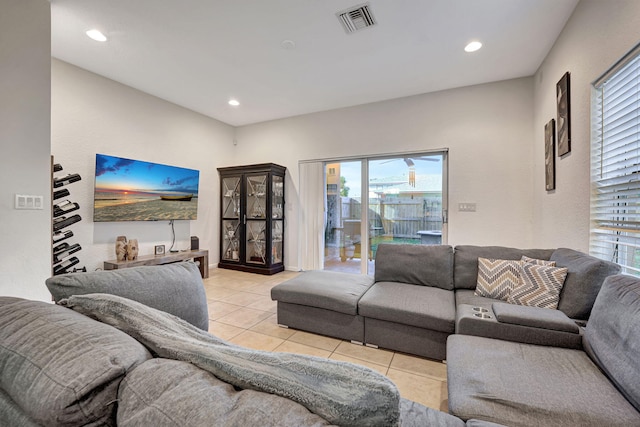 living area featuring tile patterned floors, recessed lighting, and visible vents