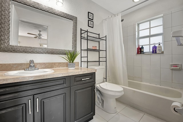 full bath with vanity, shower / bath combo, ceiling fan, tile patterned flooring, and toilet