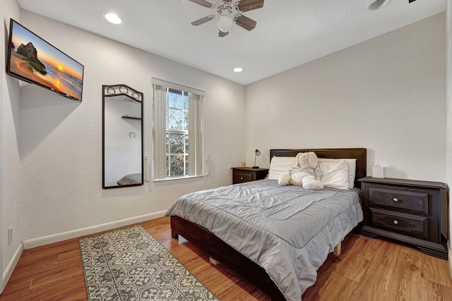 bedroom with recessed lighting, wood finished floors, baseboards, and ceiling fan