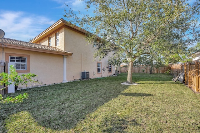 view of yard with cooling unit and a fenced backyard