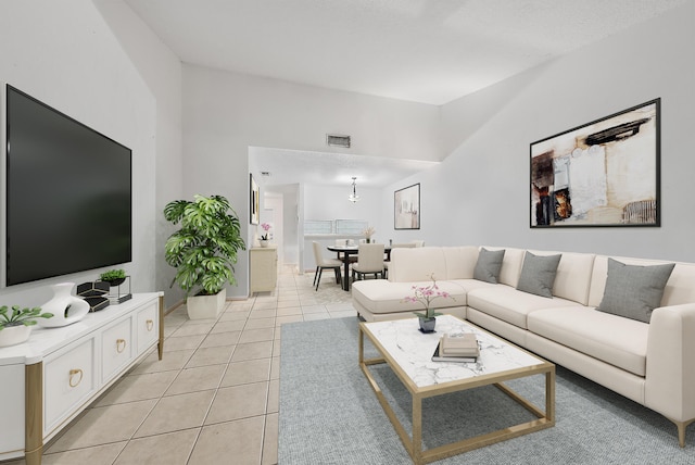 tiled living room with a high ceiling