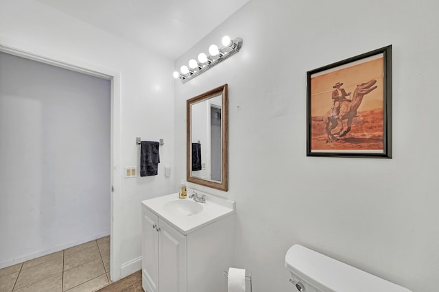 bathroom with tile patterned floors, vanity, and toilet