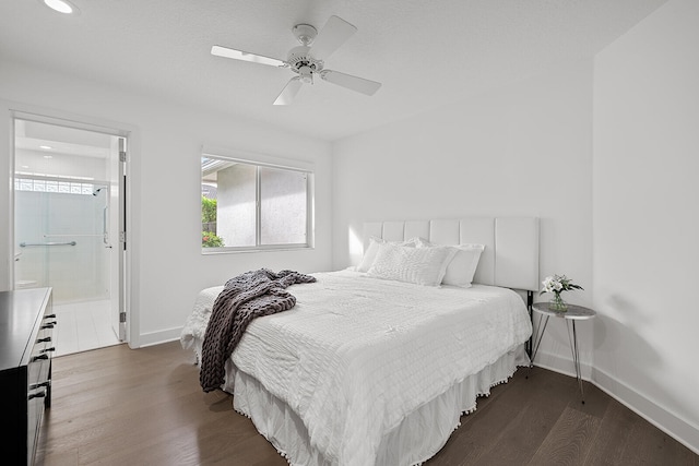 bedroom with ensuite bathroom, dark hardwood / wood-style floors, and ceiling fan