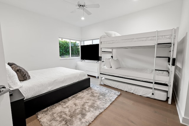 bedroom with hardwood / wood-style flooring and ceiling fan