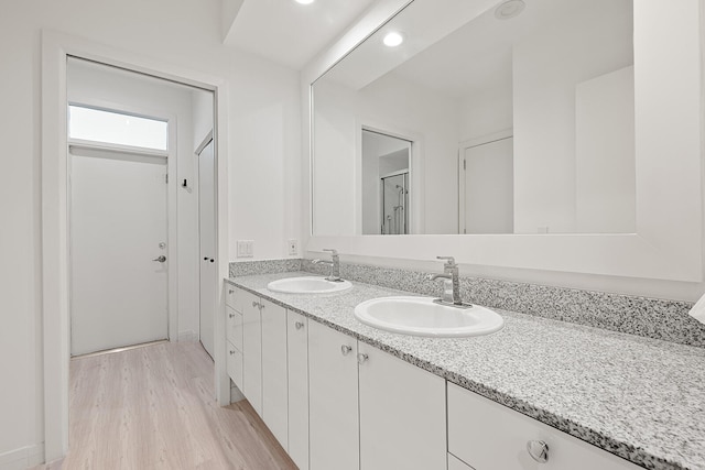 bathroom featuring vanity and hardwood / wood-style flooring