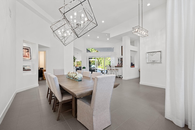 dining space featuring a high ceiling