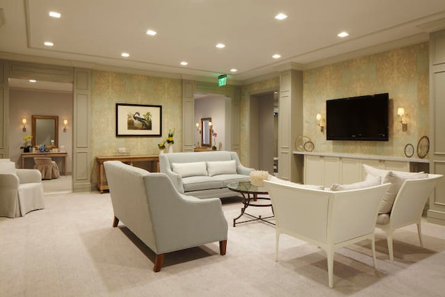 carpeted living room featuring crown molding