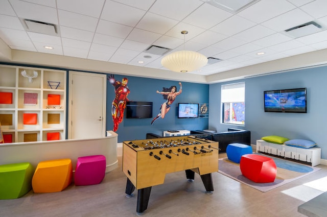 game room featuring a drop ceiling