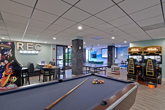 rec room with hardwood / wood-style flooring, a drop ceiling, and billiards