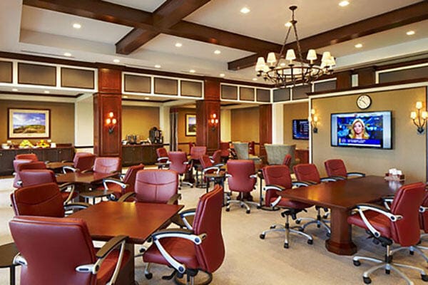 interior space featuring beamed ceiling, carpet floors, coffered ceiling, and a chandelier