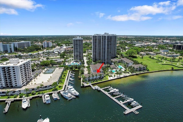 birds eye view of property with a water view