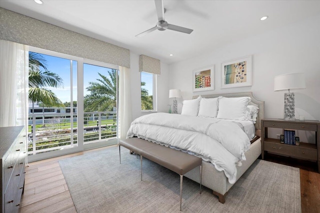 bedroom with ceiling fan, access to exterior, and light wood-type flooring