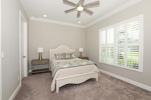 carpeted bedroom with ceiling fan and crown molding