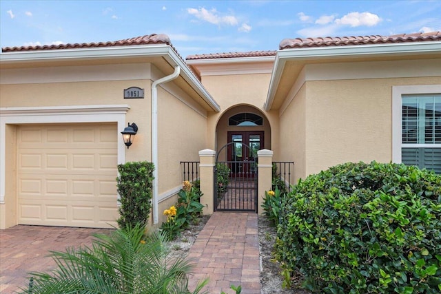 view of exterior entry featuring a garage