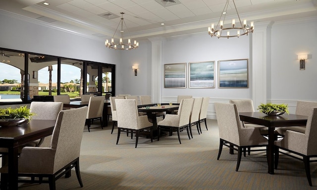 dining space with a raised ceiling, light colored carpet, a notable chandelier, and ornamental molding