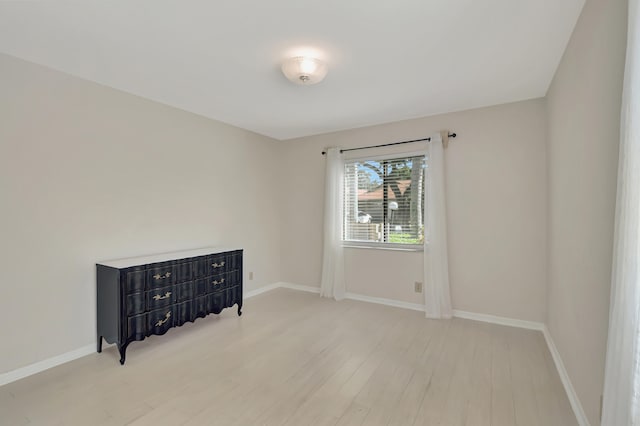 unfurnished room with light hardwood / wood-style flooring